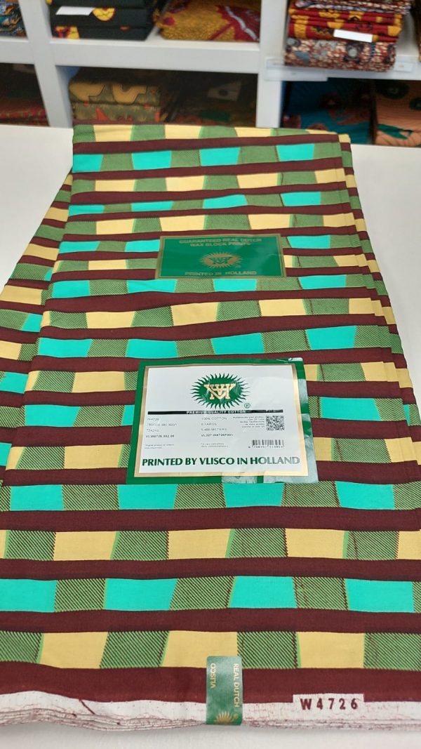 A close up of the green and brown fabric