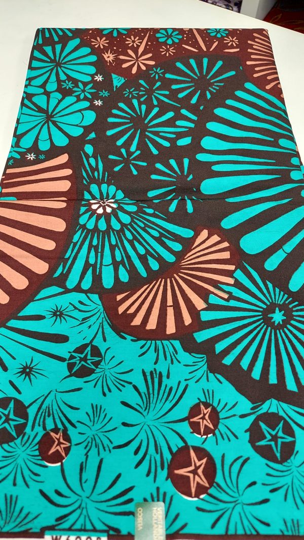 A close up of the fabric with different colored designs