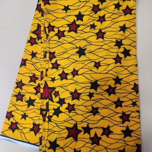 A yellow and black fabric with red stars