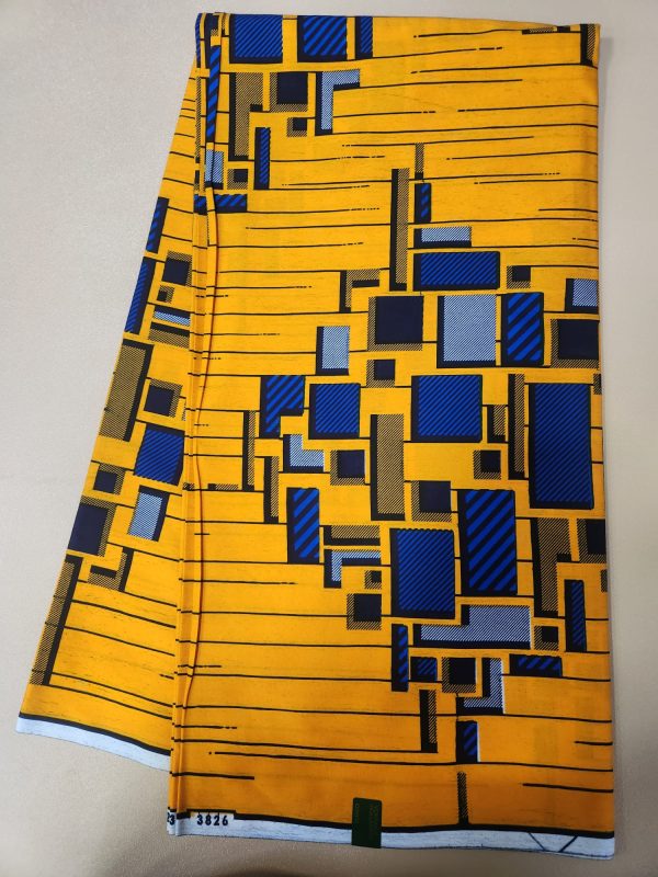 A yellow and blue fabric with squares on it