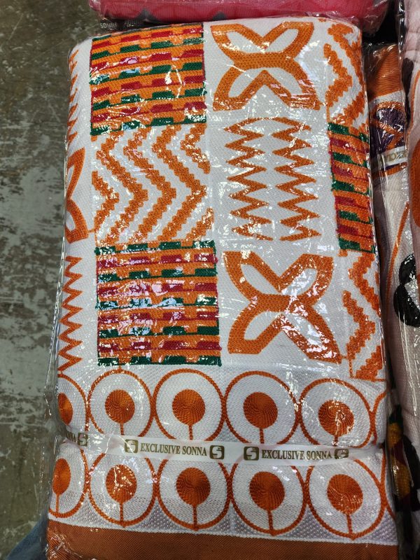 A close up of an orange and white pattern